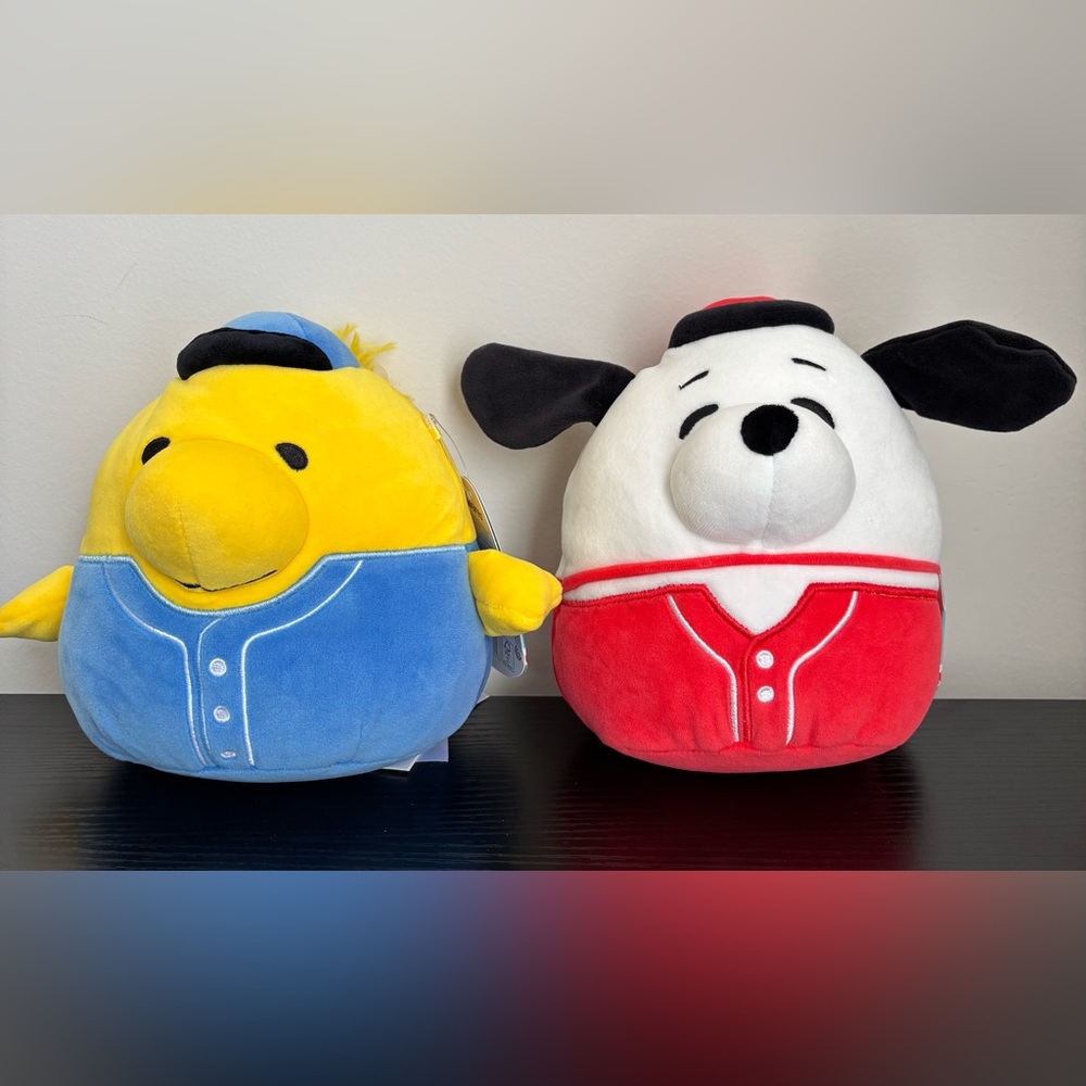 Squishmallows Peanuts Snoopy and Woodstock in a baseball jersey.